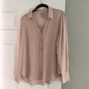 Light pink (blush) sheer long sleeve blouse.